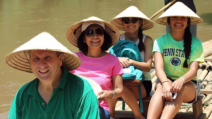 Family doing a boat ride at the Maetaman Elephant Camp